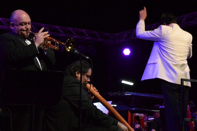 Conductor Matthew Wood, Australian trumpet master James  Morrison, and William Barton play together during Sounds of Australia,  Symphony at Uluru.