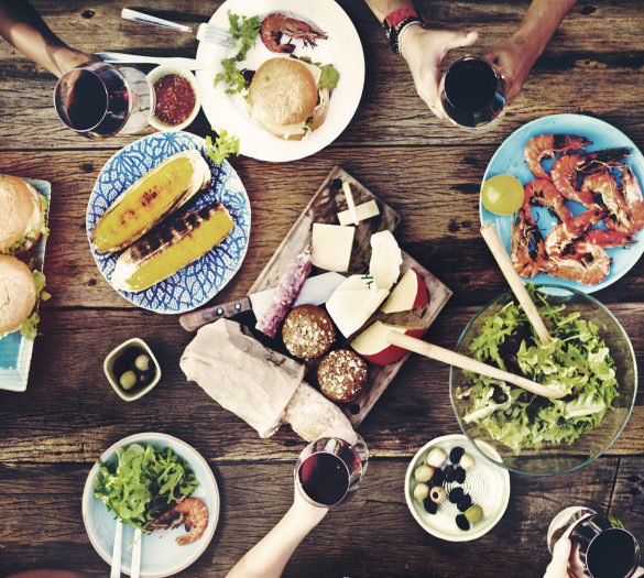 aerial view of table with food and hands