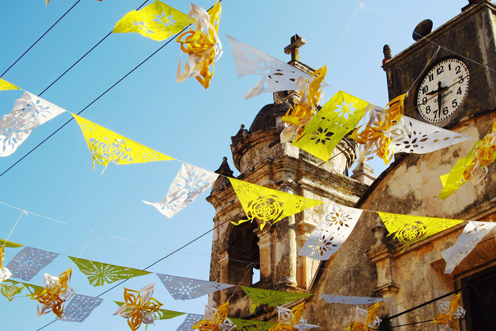 Tepoztlan-flags-waving-from-churchCROP