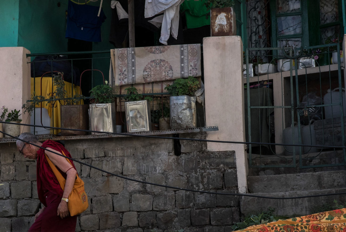 A monk leaves a friends house in Mcleod Ganj © Megan King