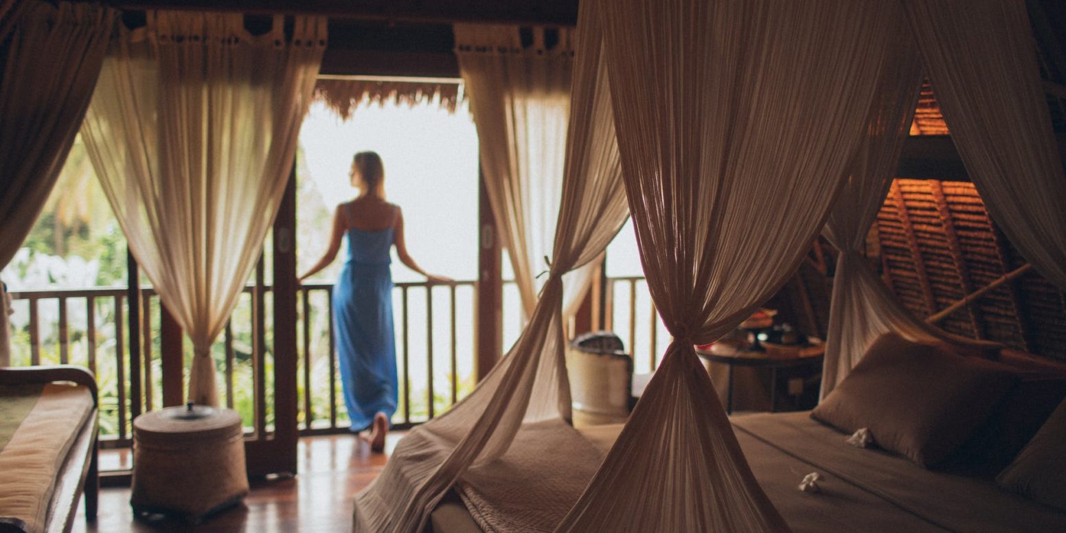 woman leaning on handrail in room